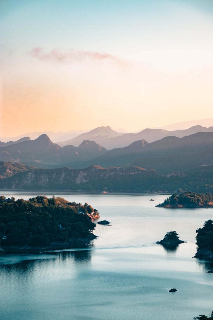 Breathtaking view of sunset over lake and mountains in Prado, Tolima, Colombia.